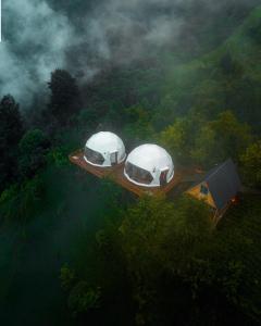 two domes on a deck in the middle of a forest at Bogina Dome & Suite - Çamlıhemşin in Çamlıhemşin