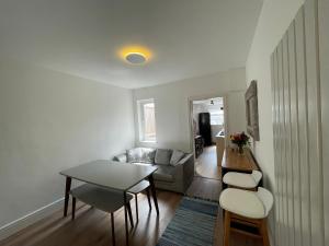 a living room with a table and a couch at Nottingham Home Stay in Nottingham