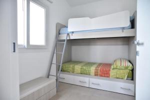 Postel nebo postele na pokoji v ubytování Appartamento Oasi con Piscina