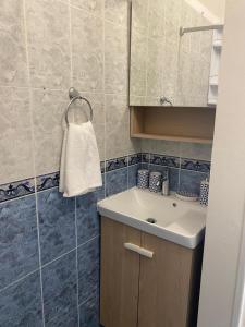 a bathroom with a sink and a shower at Beato Typical House in Lisbon