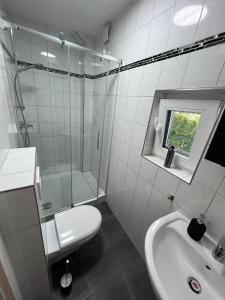 a white bathroom with a shower and a sink at Domo Dolce Studio 