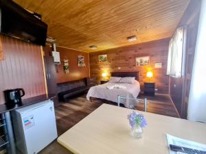 Postel nebo postele na pokoji v ubytování Cabañas Kompatzki