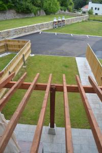 a picnic table sitting on top of a field at El Molino 3 in Muros de Nalón