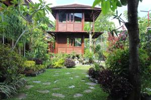 a tree house in the middle of a garden at Georium Dunia in Prambanan