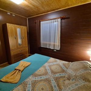 Postel nebo postele na pokoji v ubytování Cabañas Kompatzki