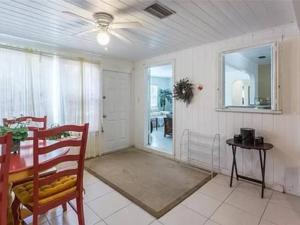 a dining room with a table and a ceiling fan at Lovely 1 Bedroom Unit Across from Lido Key Beach in Sarasota