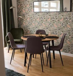a dining room with a table and chairs at Paulay Opera Apartment in Budapest