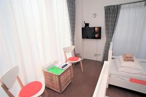 Postel nebo postele na pokoji v ubytování Numero Uno Tokyo