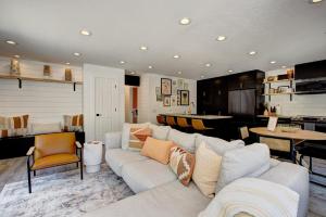 a living room with a couch and a table at Off-Broadway - Modern woutdoor haven in Boise