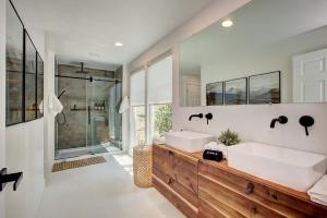 a bathroom with two sinks and a shower at Off-Broadway - Modern woutdoor haven in Boise +57 photos