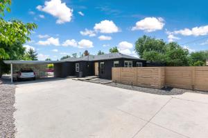 a home with a fence and a house at Off-Broadway - Modern woutdoor haven in Boise