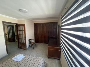Uma cama ou camas num quarto em Tradición