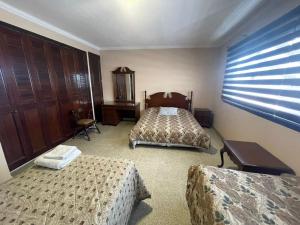 Uma cama ou camas num quarto em Tradición