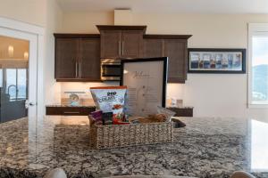 a kitchen with a counter with a basket on it at 3 bed, 2 bath upper suite overlooking the city in Vernon