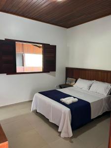 a bedroom with a large bed in a room at Casa da Serra Negra in Bezerros