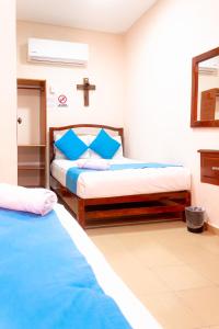 Postel nebo postele na pokoji v ubytování Hotel Bacalar Magico