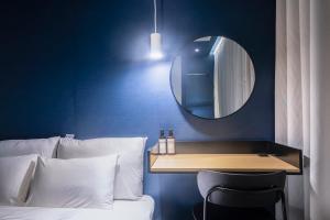 Postel nebo postele na pokoji v ubytování Croissant Hotel Guri by Aank