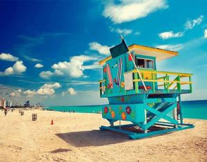 a lifeguard tower on a beach with the ocean at My Nautical Paradise in Miami in Miami