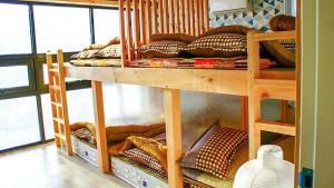 two bunk beds in a room with pillows at Sogeum Gangsan in Gyeongju