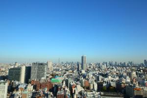 an aerial view of a city with tall buildings at Hotel Gracery Shinjuku in Tokyo