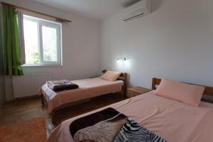 Cama o camas de una habitación en Apartments Gorančica