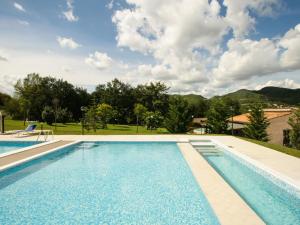 a swimming pool with a view of the mountains at Welcoming holiday home in Urbania with pool in Urbania
