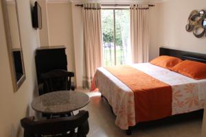 Postel nebo postele na pokoji v ubytování Hotel Castellana Inn