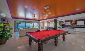 a billiard room with a red pool table at Villa Jacuzzi Seaview Villa in Chaweng Noi Beach