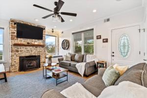 a living room with a couch and a fireplace at Zen Mountainside Retreat - Spa & Amazing Views! in Hagerstown