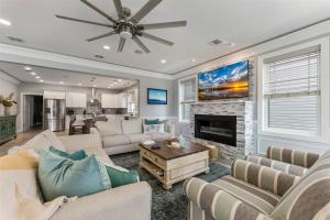 a living room with couches and a fireplace at 7208 Atlantic Ave in Wildwood Crest
