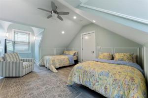 a bedroom with two beds and a ceiling fan at 7208 Atlantic Ave in Wildwood Crest