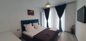 Giường trong phòng chung tại Apartament Sienna - Mamaia Nord +26 ảnh