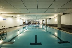 a large swimming pool with blue water at JW Marriott Hotel Frankfurt in Frankfurt