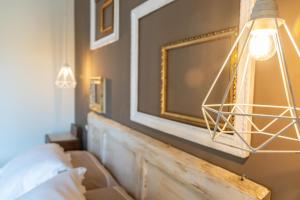 Postel nebo postele na pokoji v ubytování Palazzo NiTe