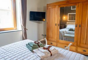 Postel nebo postele na pokoji v ubytování Palazzo NiTe