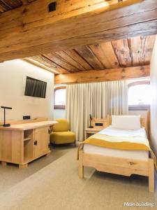 Postel nebo postele na pokoji v ubytování Hotel Spichrz