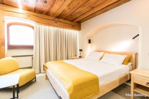 Postel nebo postele na pokoji v ubytování Hotel Spichrz