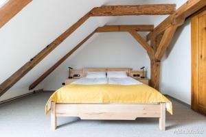 Postel nebo postele na pokoji v ubytování Hotel Spichrz