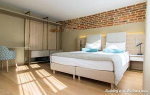 Postel nebo postele na pokoji v ubytování Hotel Spichrz