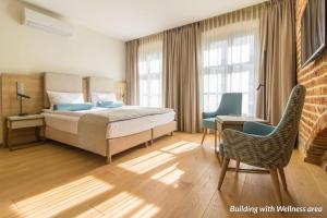 Postel nebo postele na pokoji v ubytování Hotel Spichrz