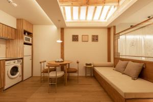 a living room with a bed and a dining room table at Luxury hanok with private bathtub - SW12 in Seoul
