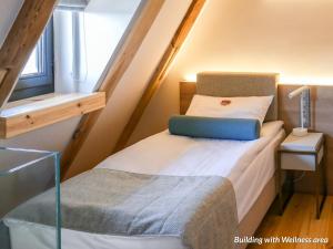 Postel nebo postele na pokoji v ubytování Hotel Spichrz