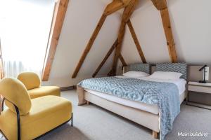 Postel nebo postele na pokoji v ubytování Hotel Spichrz