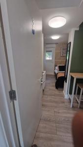 a hallway with a door leading to a room at The AppleTree in West Drayton
