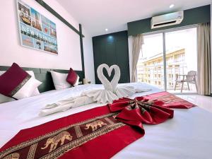 Postel nebo postele na pokoji v ubytování Hotel Baya Phuket