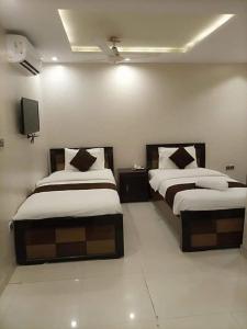 Hotel Tulip Inn Rawalpindi 객실 침대
