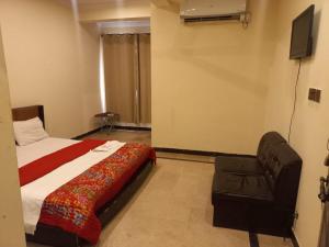 Hotel Tulip Inn Rawalpindi 객실 침대