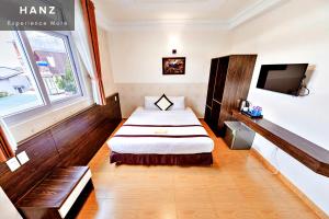 Giường trong phòng chung tại HANZ Thien Nien Ky Hotel