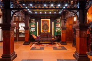 a living room with a couch in the middle of a building at Borei Angkor Resort & Spa in Siem Reap