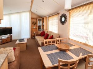 a living room with a couch and a table at Stanley's Sanctuary in Cockermouth